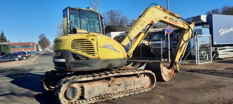 2006 Yanmar SV100 mini excavator, rear three-quarter view 2006 Yanmar SV100 mini excavator, rear three-quarter view