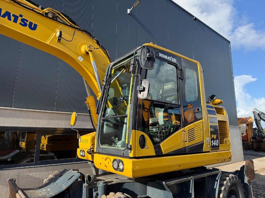 2019 Komatsu PW148-11 wheel excavator, side view of cab and boom