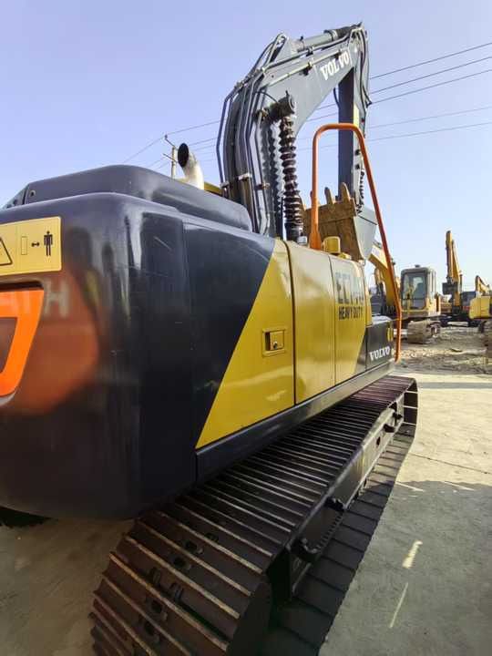 2023 Volvo EC140 crawler excavator, rear three-quarter view