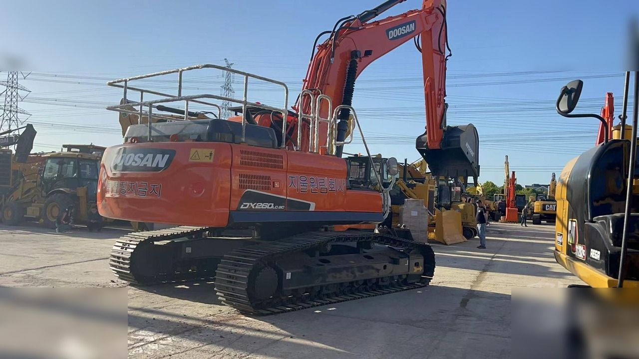 2020 Doosan DX260LC crawler excavator, rear three-quarter view 2020 Doosan DX260LC crawler excavator, rear three-quarter view