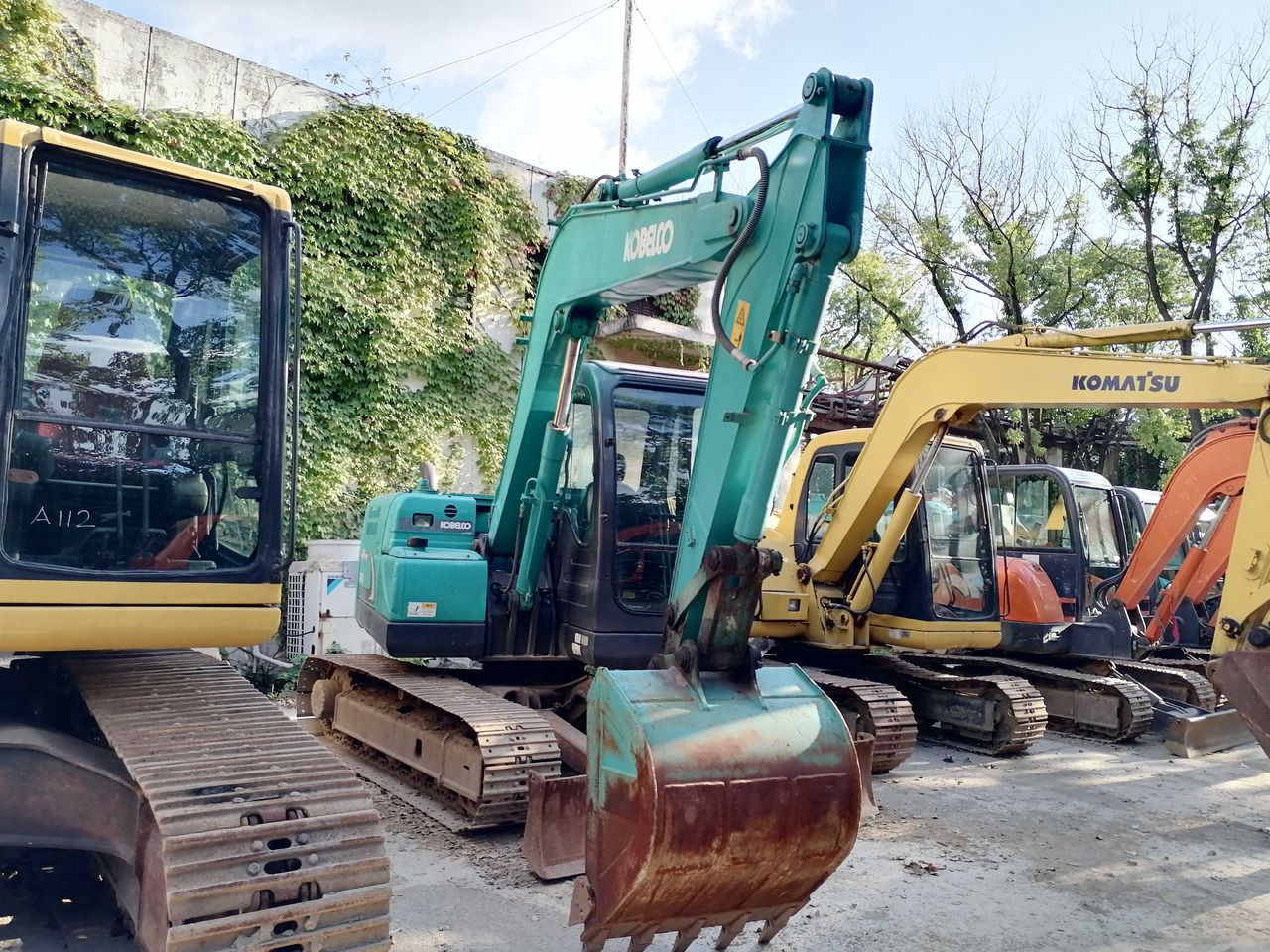 2022 Kobelco SK75-8 excavator, front three-quarter view