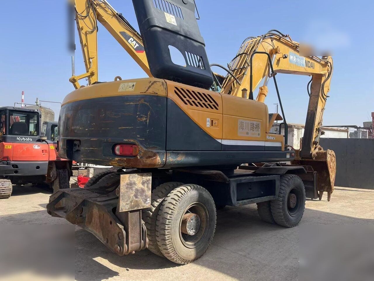 2024 Hyundai Robex 210W-9 wheel excavator, rear three-quarter view 2024 Hyundai Robex 210W-9 wheel excavator, rear three-quarter view