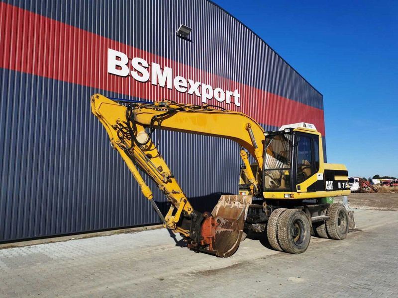 1996 Caterpillar M315 wheel excavator, side profile view 1996 Caterpillar M315 wheel excavator, side profile view