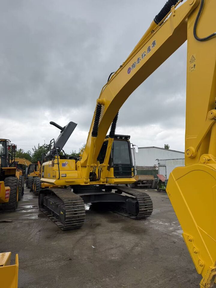 2025 Komatsu PC300 crawler excavator, front three-quarter view