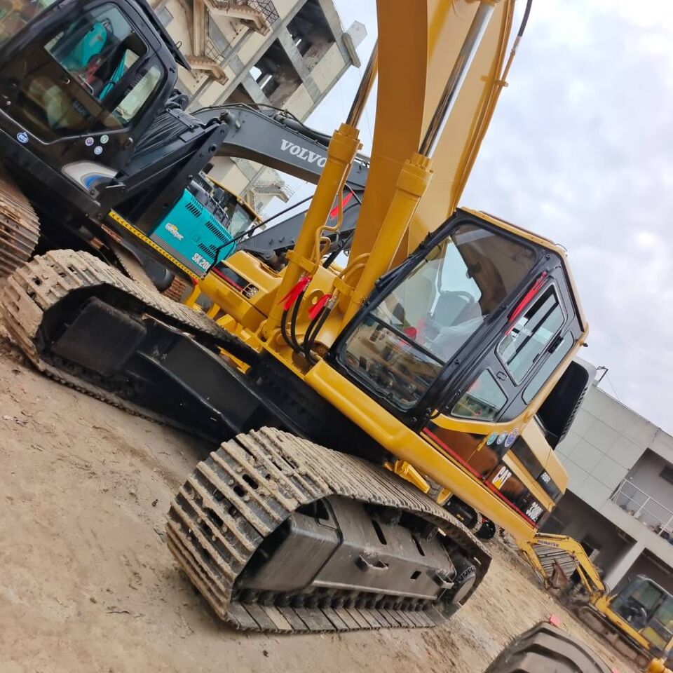 2024 Caterpillar 330BL crawler excavator, low-angle side view