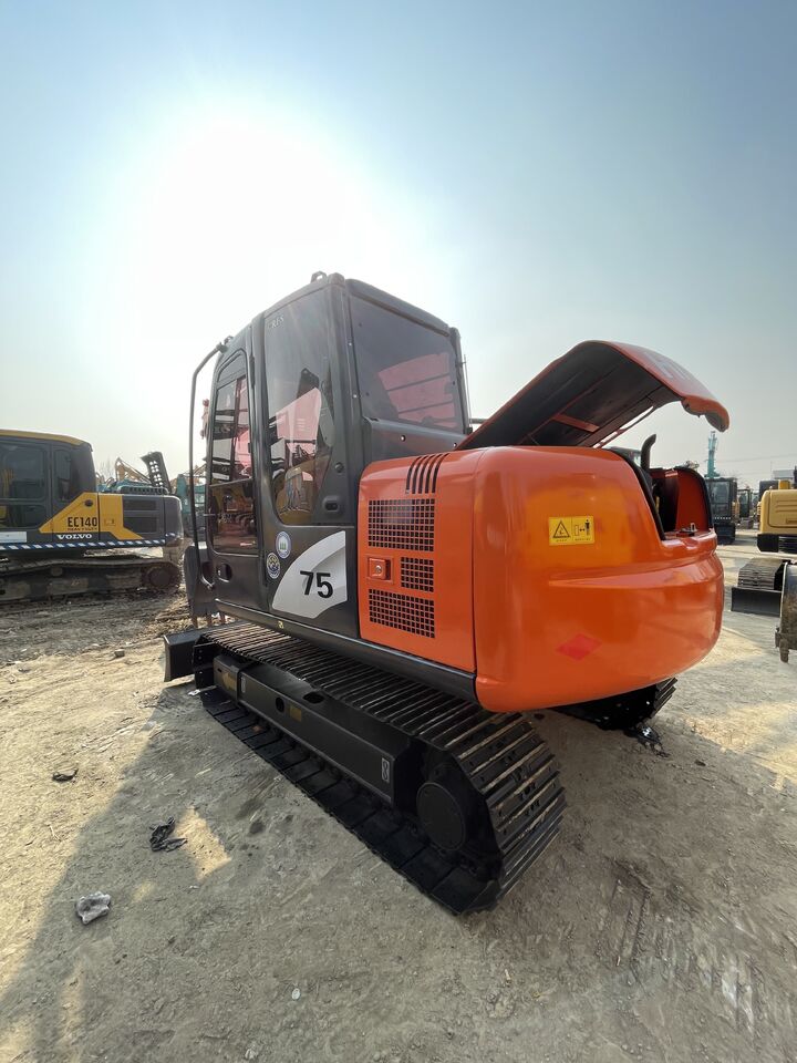 2023 Hitachi ZX75 crawler excavator, rear three-quarter view 2023 Hitachi ZX75 crawler excavator, rear three-quarter view