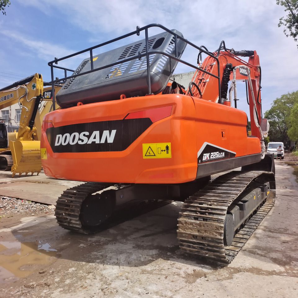 2024 Doosan DX225LCA crawler excavator, rear three-quarter view 2024 Doosan DX225LCA crawler excavator, rear three-quarter view