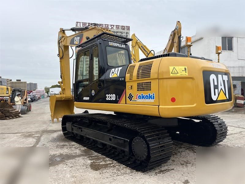 2024 Caterpillar 323D crawler excavator, rear three-quarter view