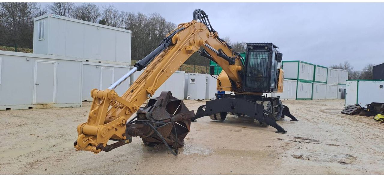 2021 Caterpillar MH3022-07 wheel excavator, front three-quarter view 2021 Caterpillar MH3022-07 wheel excavator, front three-quarter view