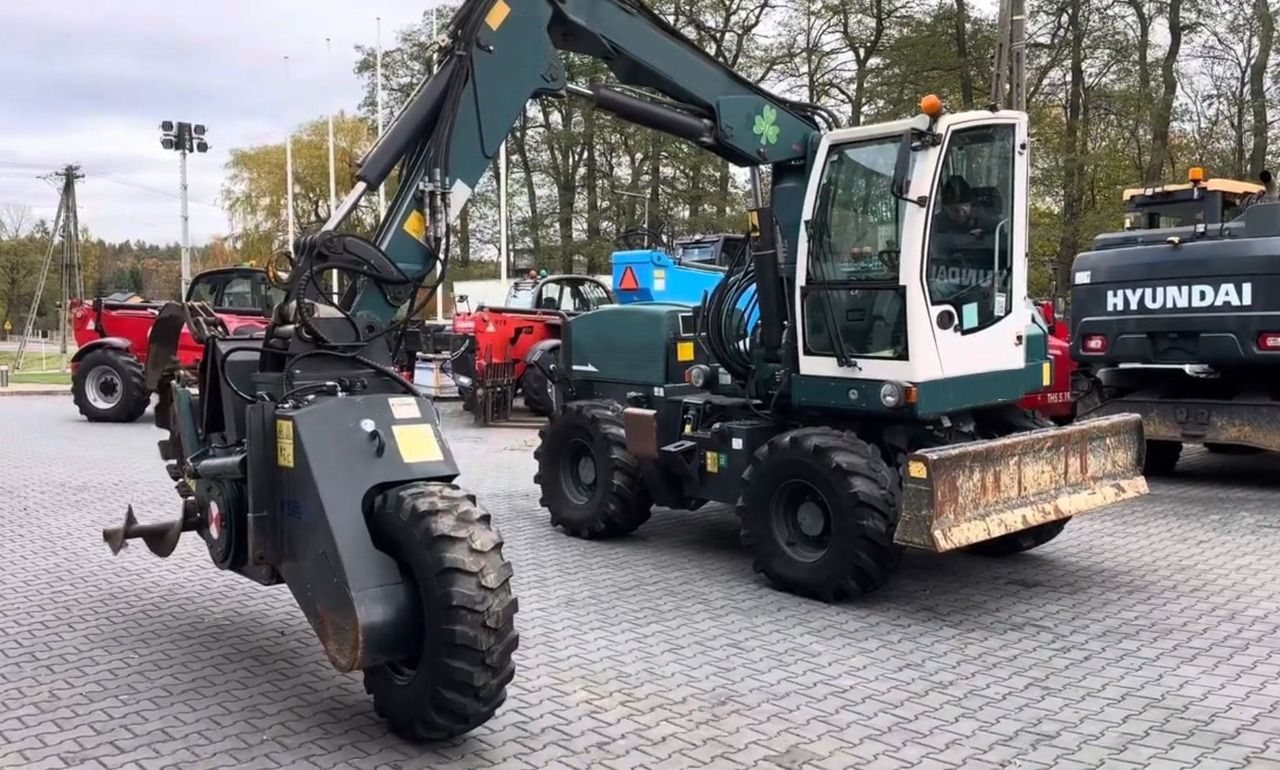 2015 Gallmac TG12 wheel excavator, side view with auger attachment