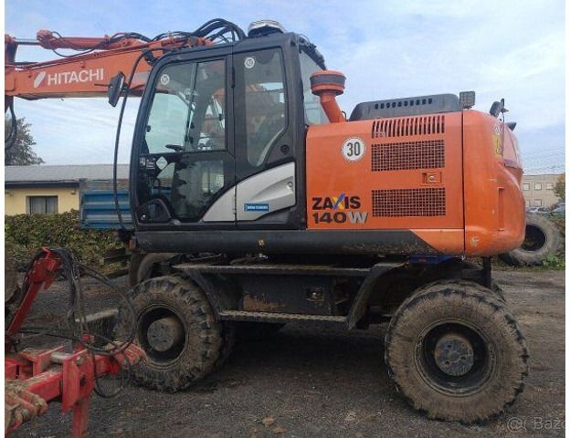 2014 Hitachi Zaxis 140W wheel excavator, side profile view