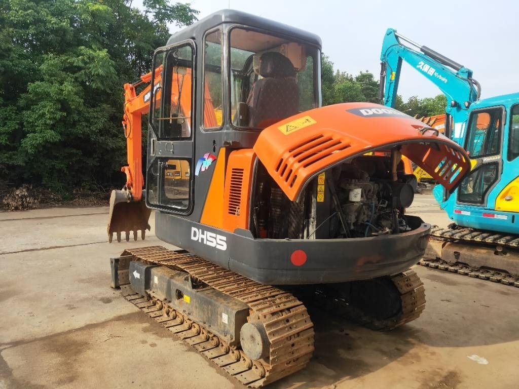 2023 Doosan DH55 mini excavator rear three-quarter view 2023 Doosan DH55 mini excavator rear three-quarter view