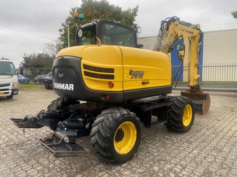 2021 Yanmar B95W wheel excavator, rear three-quarter view 2021 Yanmar B95W wheel excavator, rear three-quarter view