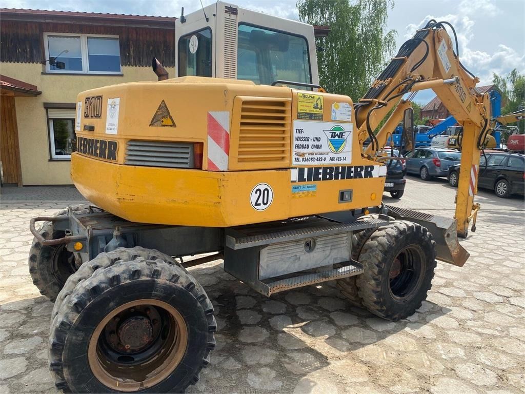 2000 Liebherr A310B wheel excavator, rear three-quarter view 2000 Liebherr A310B wheel excavator, rear three-quarter view