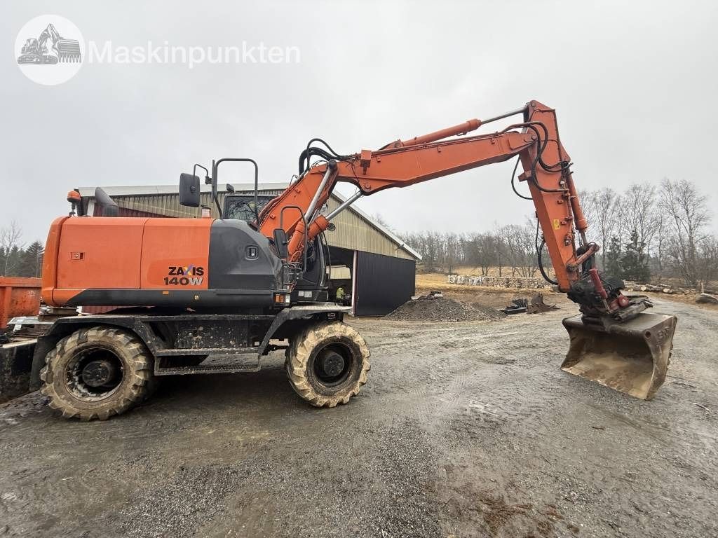 2013 Hitachi Zaxis 140W wheel excavator, side view