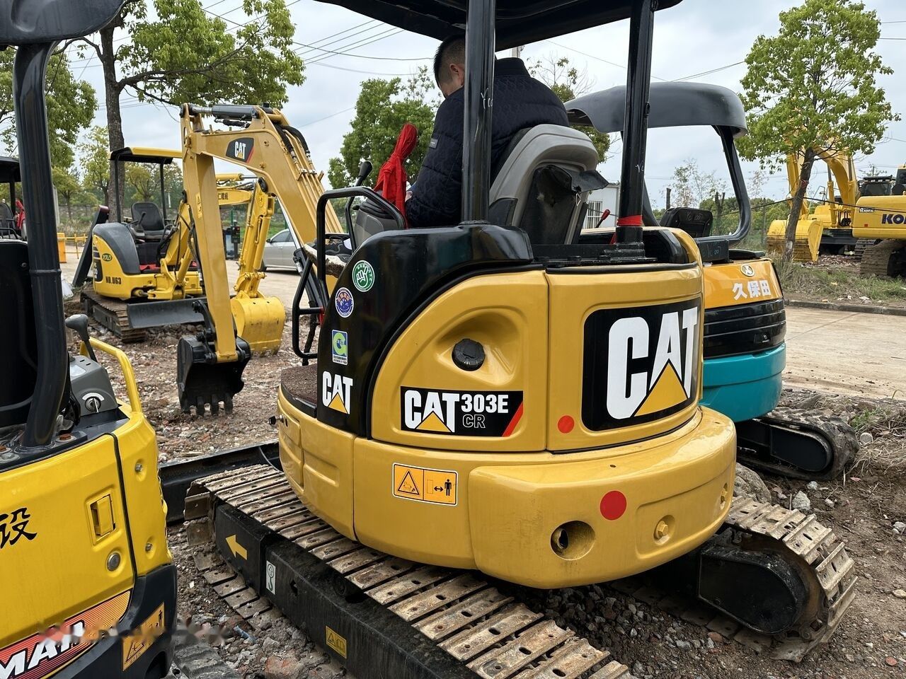 Caterpillar 303E CR mini excavator rear view Caterpillar 303E CR mini excavator rear view