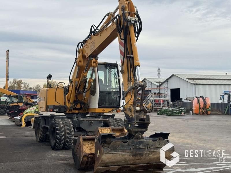 2004 Liebherr A312 Litronic wheel excavator, front three-quarter view 2004 Liebherr A312 Litronic wheel excavator, front three-quarter view