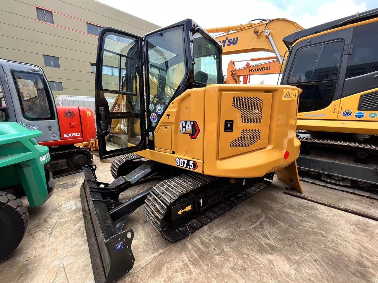 2023 Caterpillar 307.5 mini excavator, rear three-quarter view 2023 Caterpillar 307.5 mini excavator, rear three-quarter view