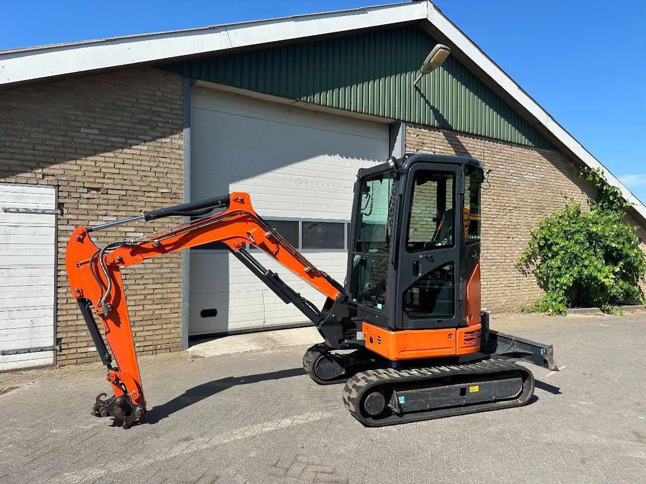Hitachi ZX26U-6CR mini excavator, side view Hitachi ZX26U-6CR mini excavator, side view