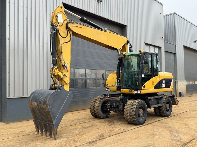 2008 Caterpillar M315D wheel excavator, front three-quarter view 2008 Caterpillar M315D wheel excavator, front three-quarter view