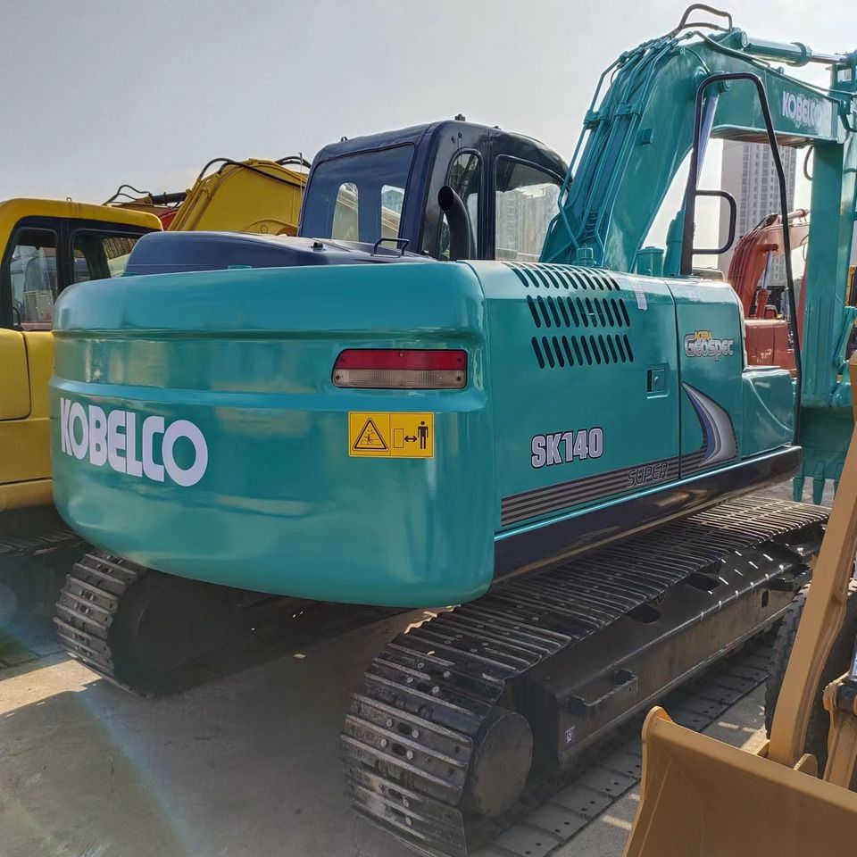 2018 Kobelco SK140 crawler excavator rear three-quarter view 2018 Kobelco SK140 crawler excavator rear three-quarter view
