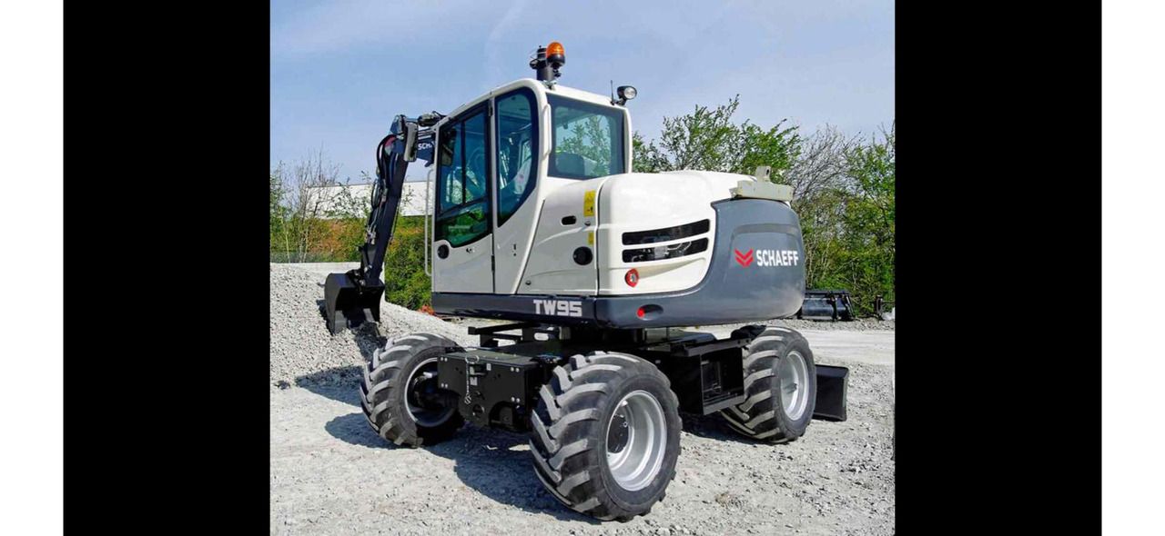 2017 Schaeff TW95 wheel excavator, rear three-quarter view 2017 Schaeff TW95 wheel excavator, rear three-quarter view