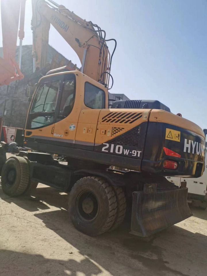 2016 Hyundai 210W-9T wheel excavator, rear three-quarter view
