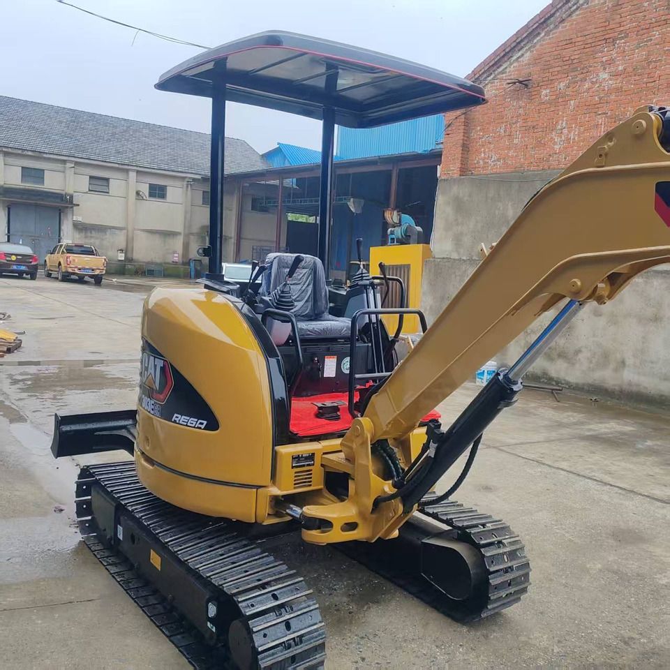 2022 Caterpillar 303E CR mini excavator, rear three-quarter view 2022 Caterpillar 303E CR mini excavator, rear three-quarter view