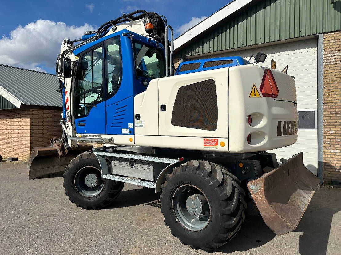 2015 Liebherr A914 wheel excavator, rear three-quarter view 2015 Liebherr A914 wheel excavator, rear three-quarter view