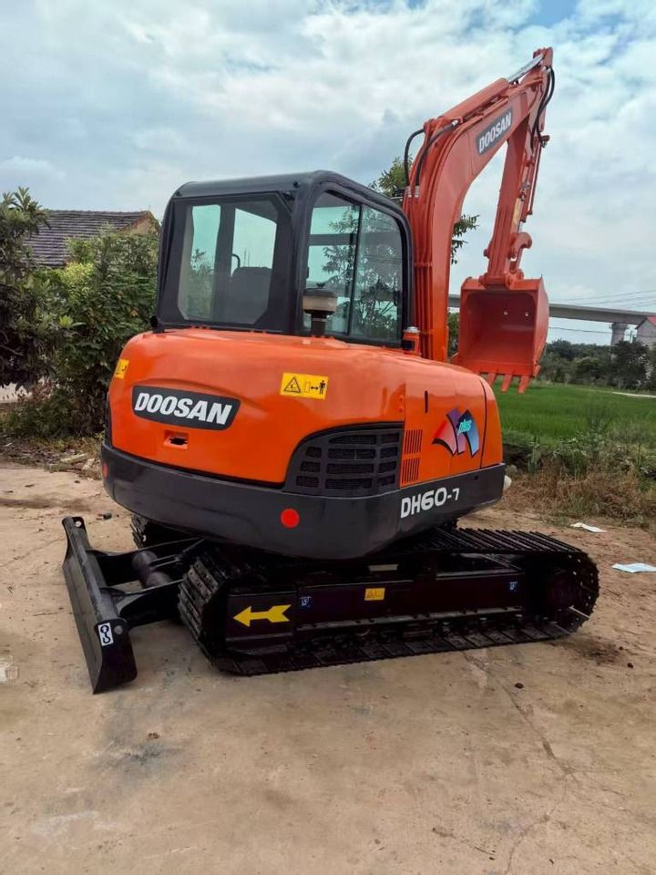 2025 Doosan DH60-7 mini excavator, front three-quarter view