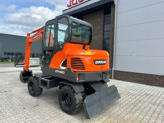 2018 Doosan DX60 wheel excavator, front three-quarter view 2018 Doosan DX60 wheel excavator, front three-quarter view