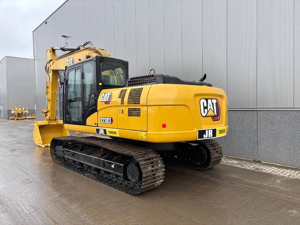 2026 Caterpillar 323D3 crawler excavator, rear three-quarter view 2026 Caterpillar 323D3 crawler excavator, rear three-quarter view