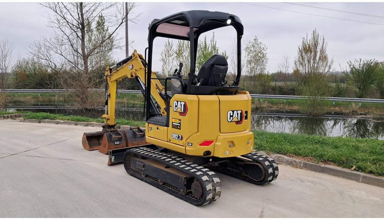 2023 Caterpillar 302.7 crawler excavator, rear three-quarter view