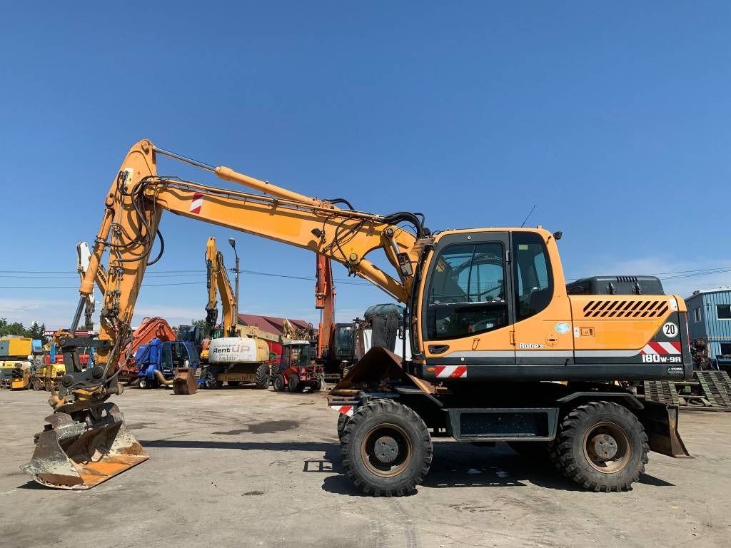 2014 Hyundai Robex 180W-9A wheel excavator, side view 2014 Hyundai Robex 180W-9A wheel excavator, side view