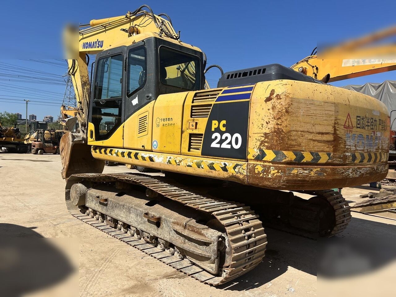 2024 Komatsu PC220 crawler excavator, rear three-quarter view 2024 Komatsu PC220 crawler excavator, rear three-quarter view