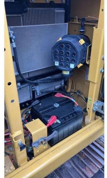 2022 Caterpillar 313GC crawler excavator battery and cooling compartment view