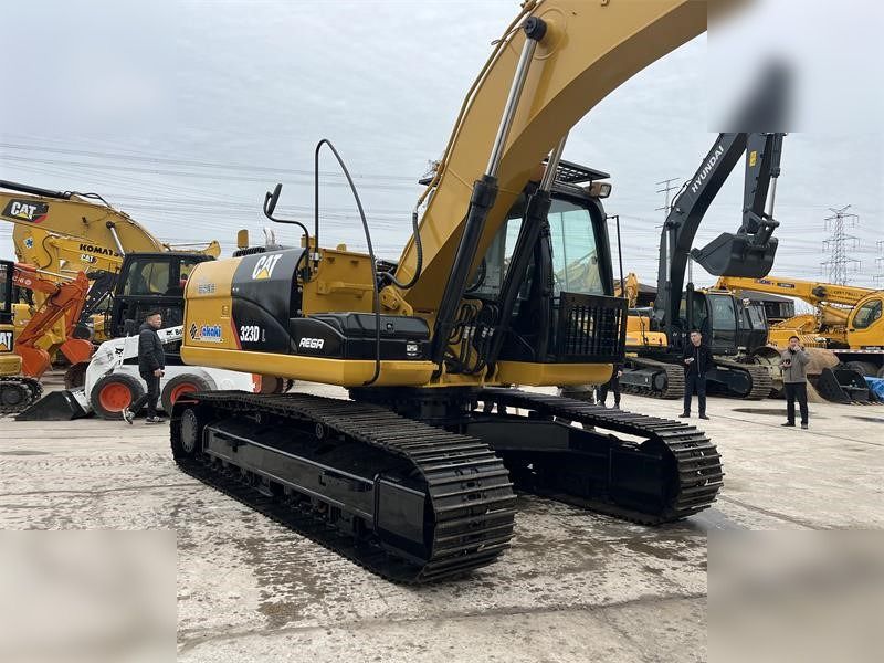 2024 Caterpillar 323D crawler excavator, rear three-quarter view