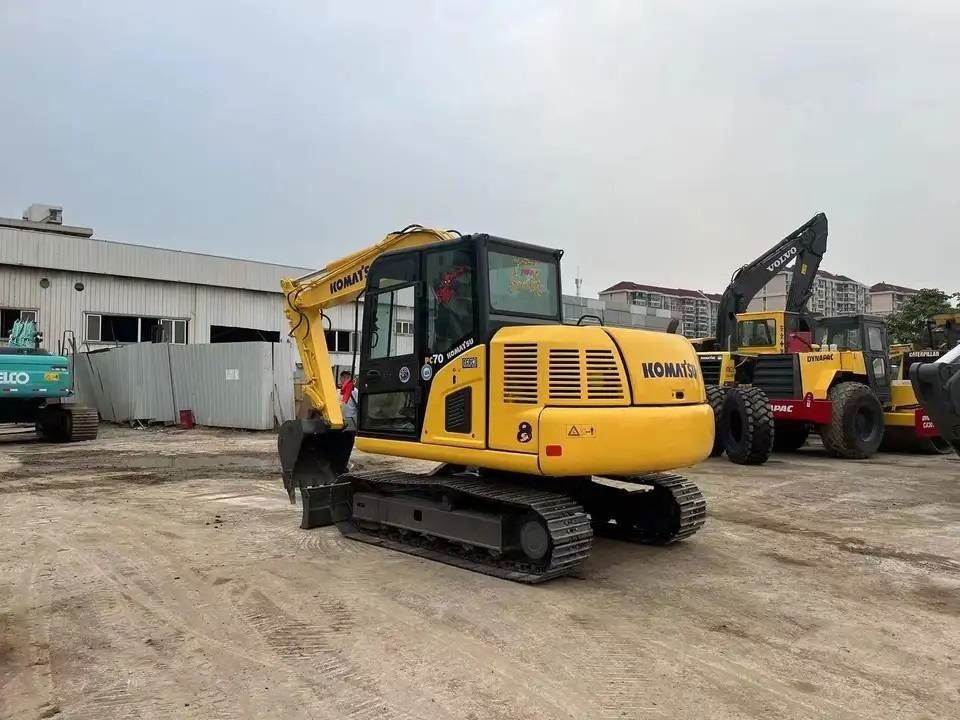 2024 Komatsu PC70-8 mini excavator, rear three-quarter view 2024 Komatsu PC70-8 mini excavator, rear three-quarter view