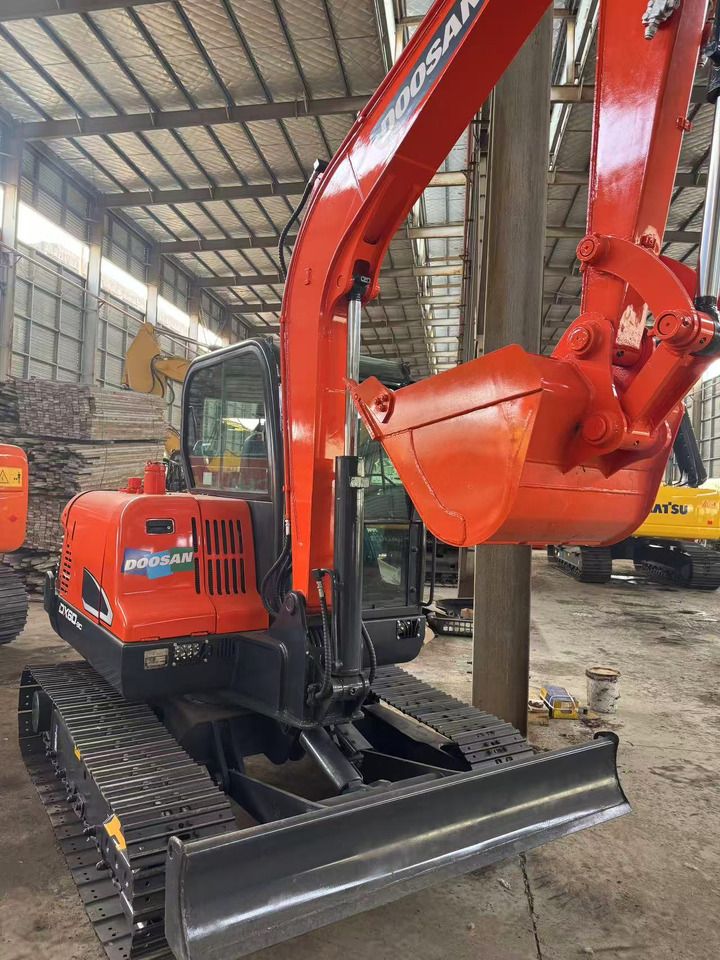 2020 Doosan DX60-9C mini excavator, front three-quarter view 2020 Doosan DX60-9C mini excavator, front three-quarter view