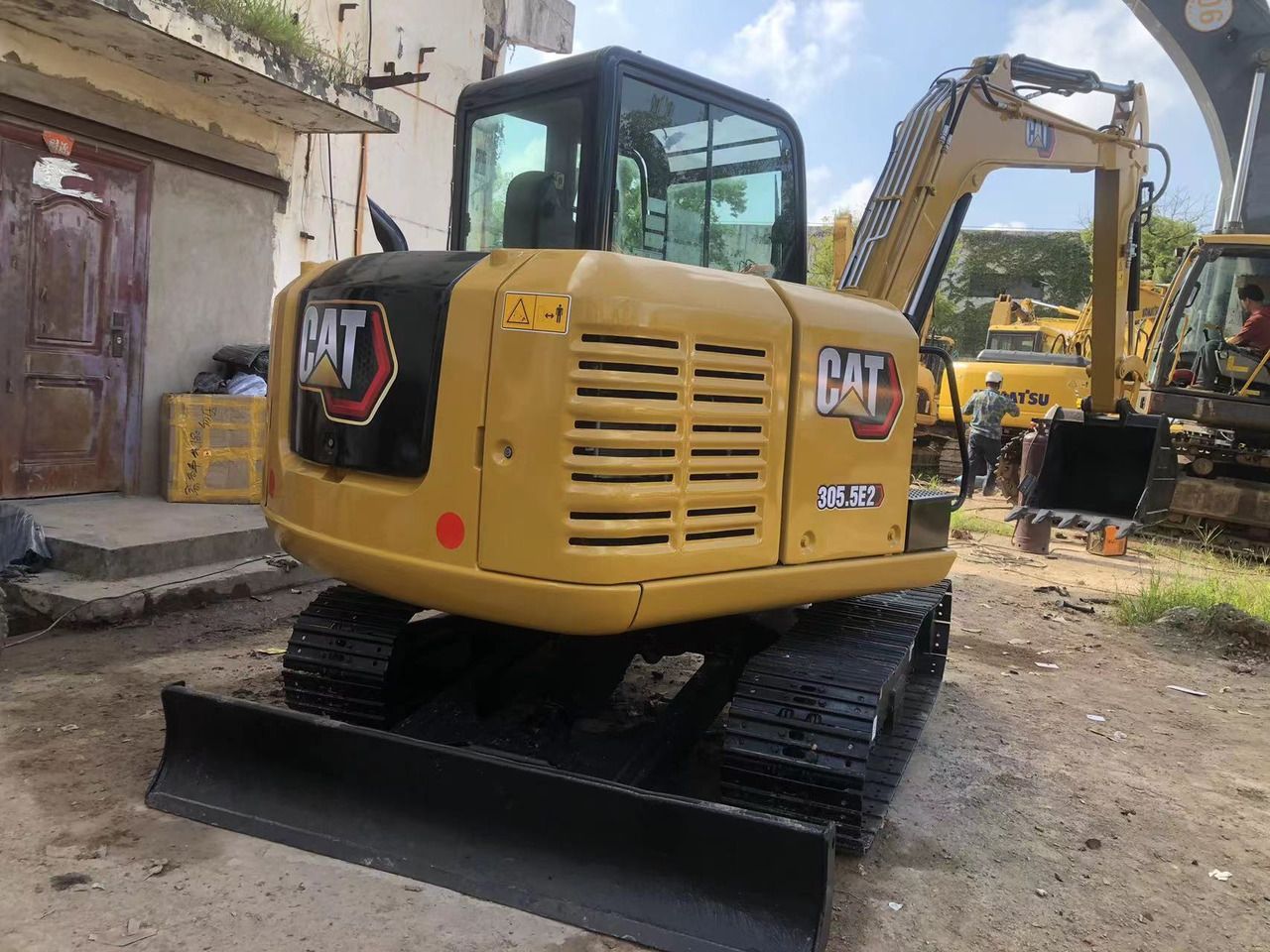 2011 Caterpillar 305.5E2 mini excavator, rear three-quarter view 2011 Caterpillar 305.5E2 mini excavator, rear three-quarter view