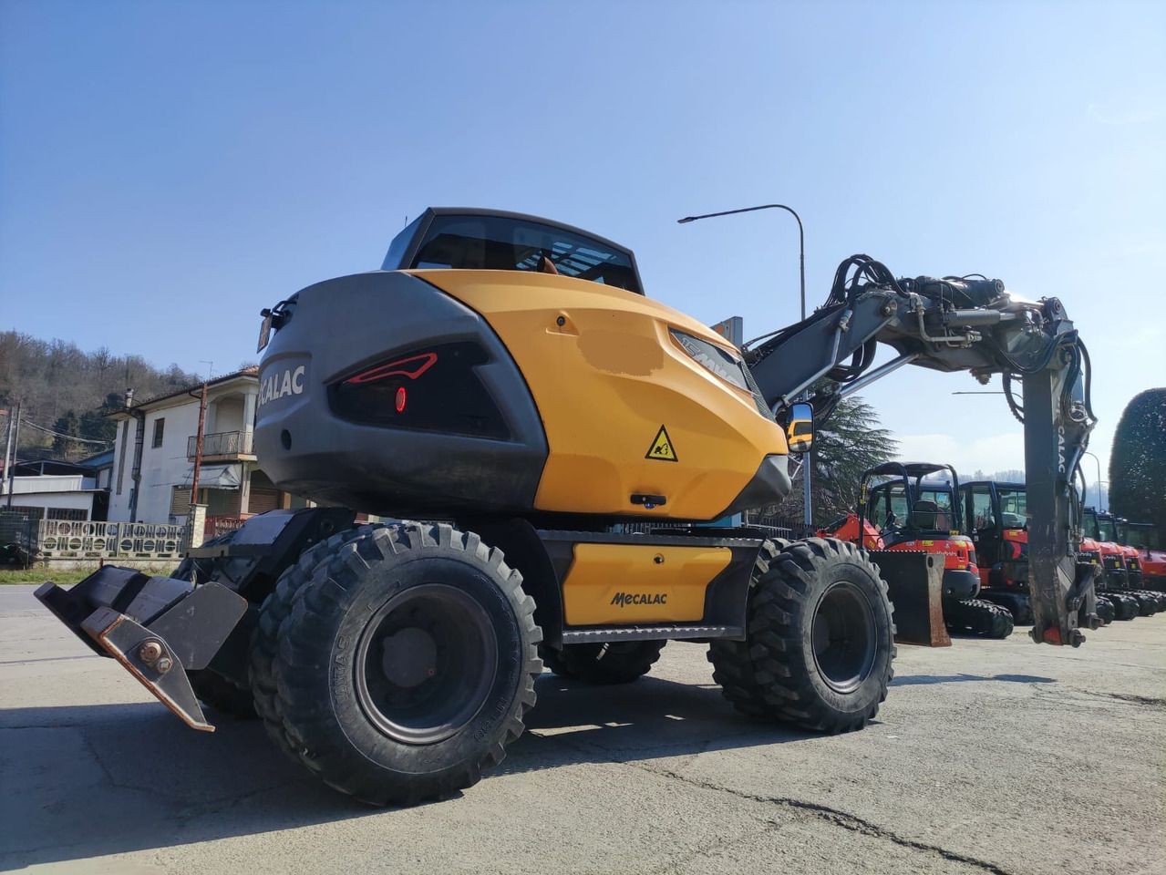 2019 Mecalac 15 MWR wheel excavator, rear three-quarter view 2019 Mecalac 15 MWR wheel excavator, rear three-quarter view
