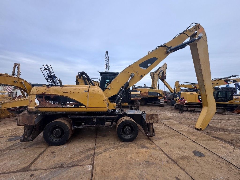 2012 Caterpillar M322D MH material handler, side view