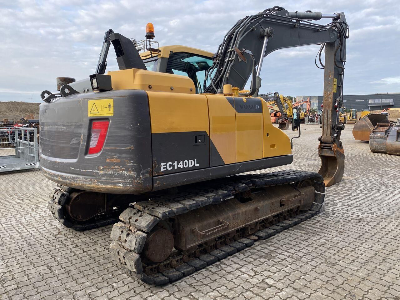 2013 Volvo EC140DL crawler excavator, rear three-quarter view