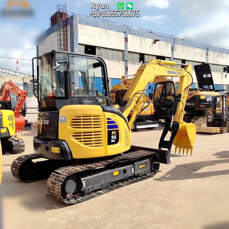 Komatsu PC55MR-2 mini excavator, rear three-quarter view Komatsu PC55MR-2 mini excavator, rear three-quarter view