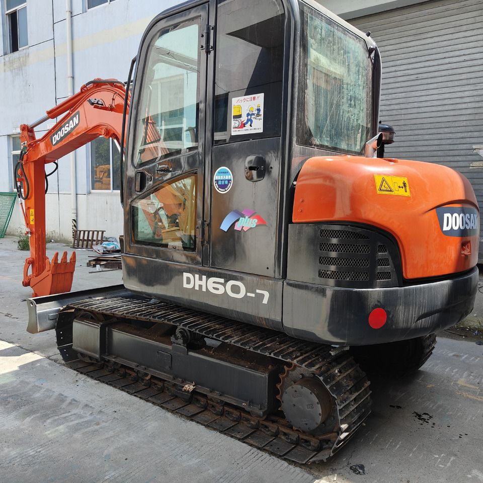 Doosan DH60-7 mini excavator, rear three-quarter view Doosan DH60-7 mini excavator, rear three-quarter view