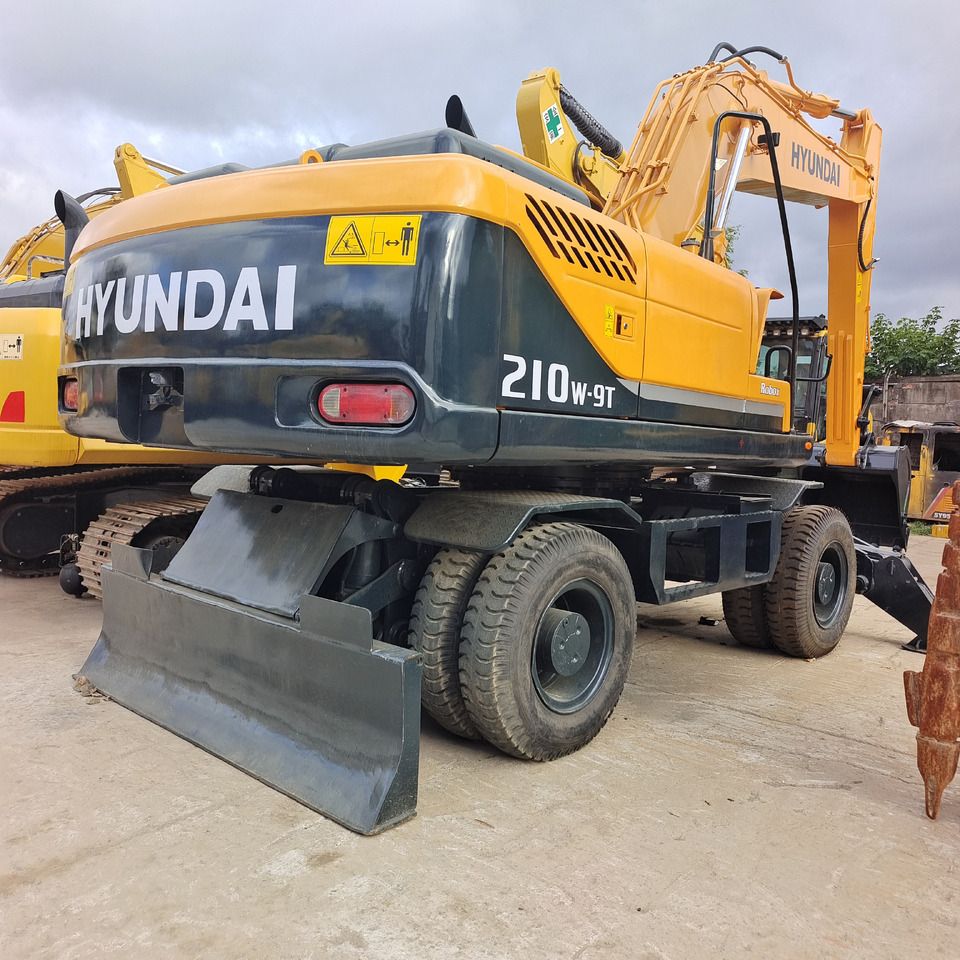 2024 Hyundai 210W-9T wheel excavator rear three-quarter view