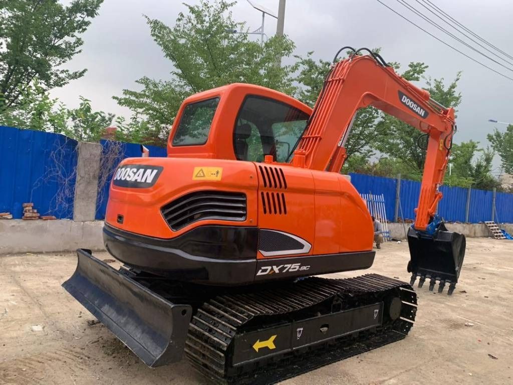 2023 Doosan DX75-9C mini excavator, rear three-quarter view 2023 Doosan DX75-9C mini excavator, rear three-quarter view