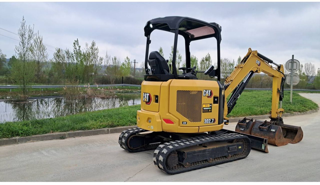 2023 Caterpillar 302.7 crawler excavator, rear three-quarter view