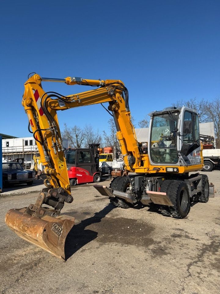 2012 New Holland MH 2.6 wheel excavator, side view 2012 New Holland MH 2.6 wheel excavator, side view