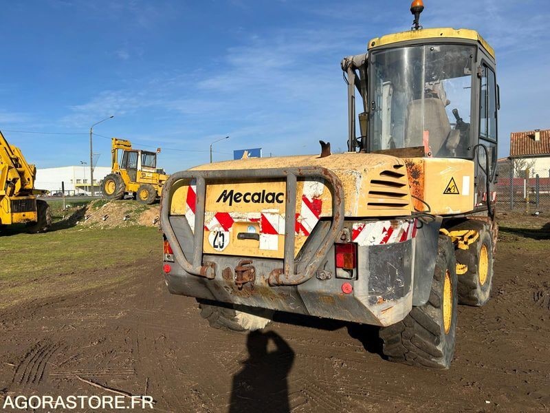 2002 Mecalac 12MXT wheel excavator rear view 2002 Mecalac 12MXT wheel excavator rear view
